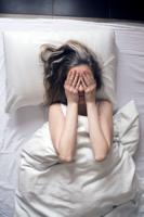 Photo of Woman having insomnia in bed